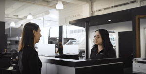 Customer talking to a service advisor in a dealership